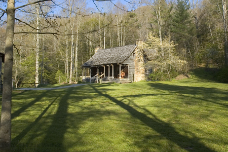 Log Cabin with Spinning Wheel